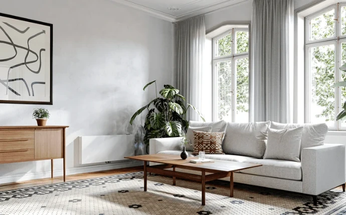 Jaga Strada Hybrid MM warmtepompradiator in een moderne woonkamer